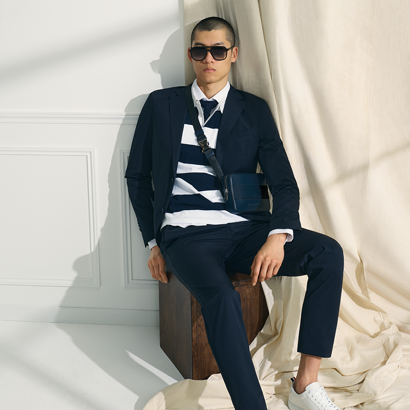 Marine Suit Styling Sleek marine look with blue suit an striped poloshirt