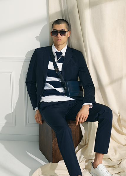 Marine Suit Styling Sleek marine look with blue suit an striped poloshirt