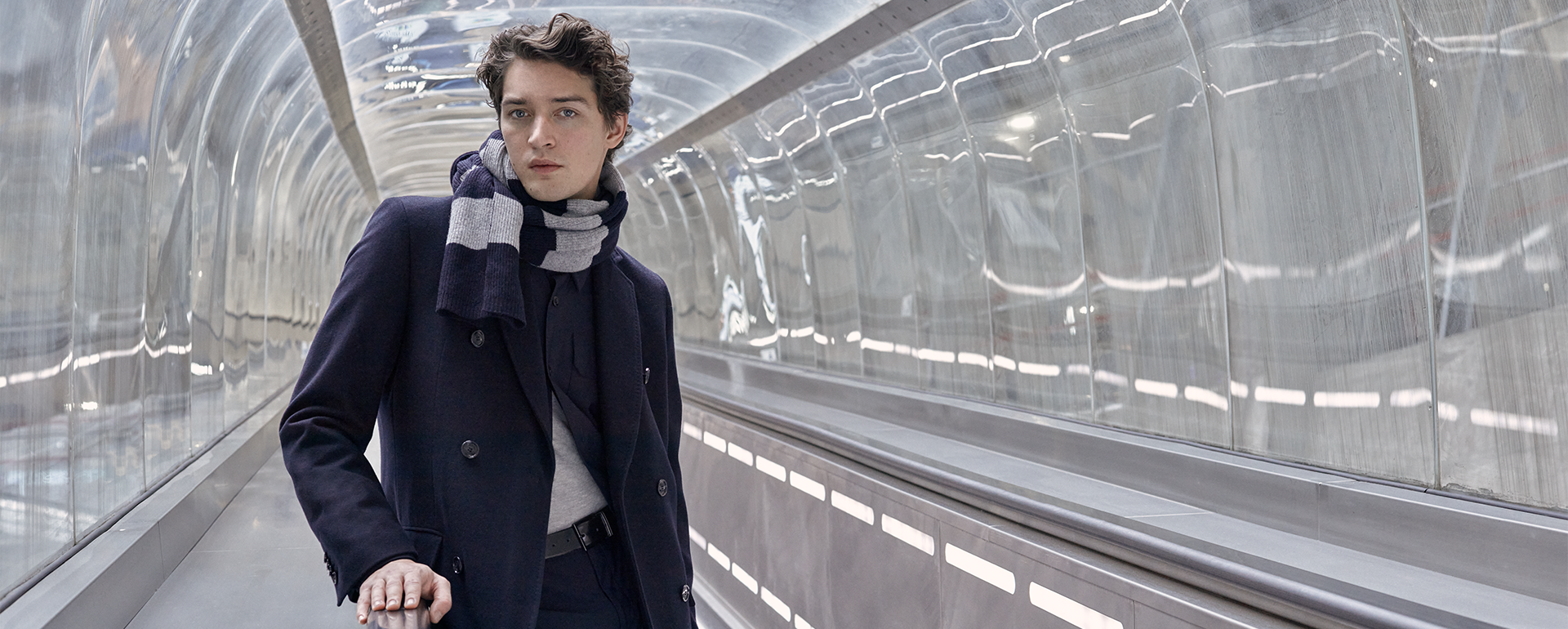 Fashion culture from France Man on a escalator at the airport