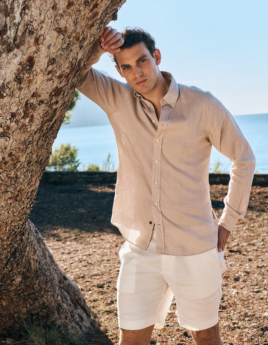 Man in summer shirt and white shorts