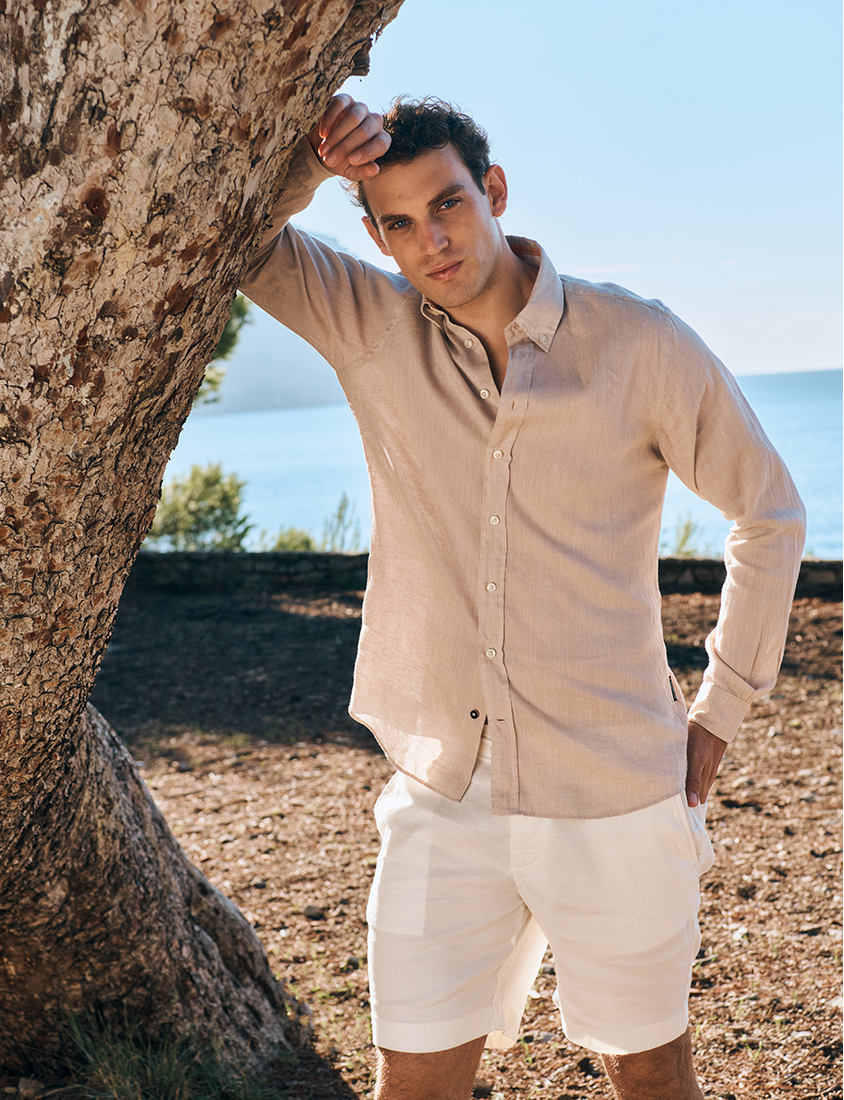 Man in summer shirt and white shorts